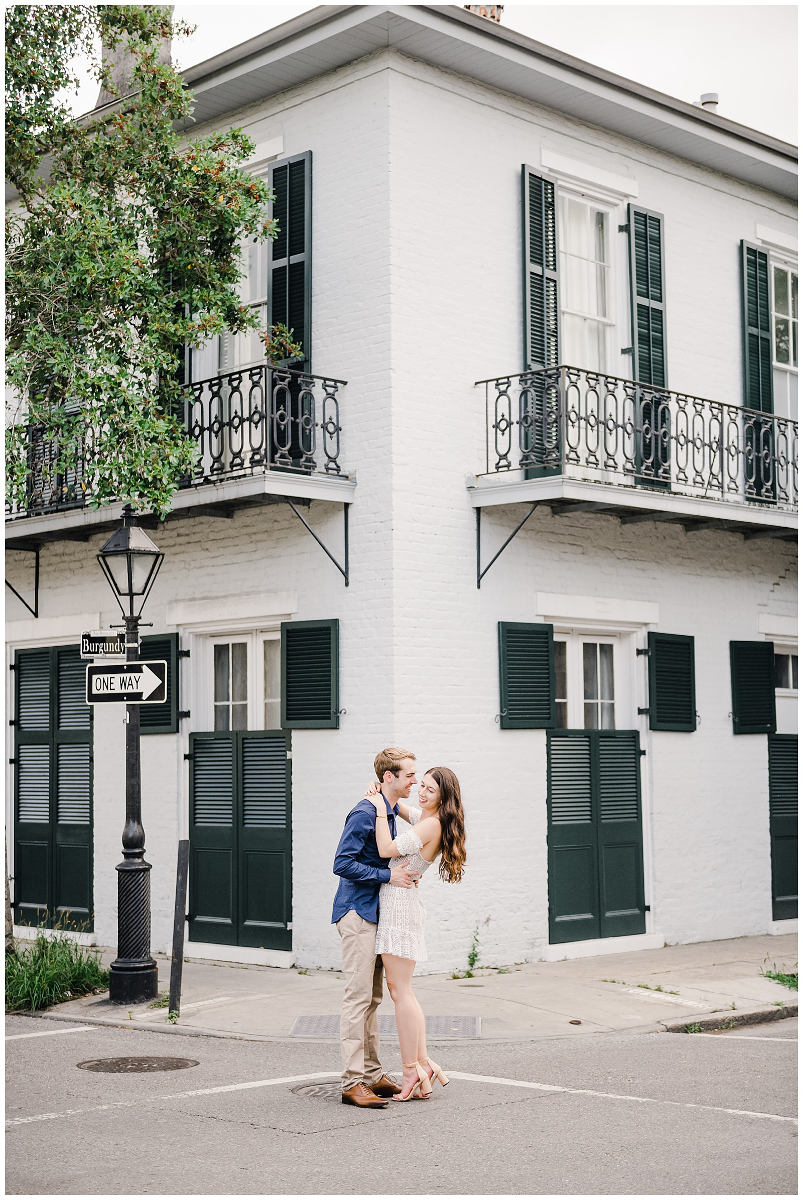 New Orleans Engagement Photos Chelsea Rousey Photography couple in love in front of white house in the french quarter