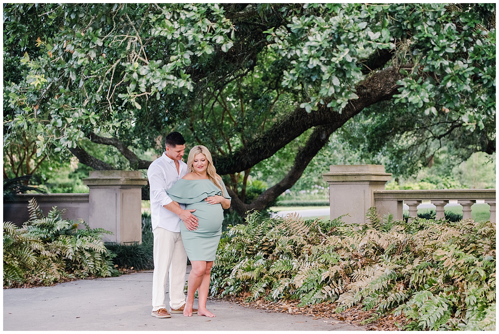 New Orleans Maternity Photographer Chelsea Rousey Photography pregnant mom with dad walking in park in new orleans